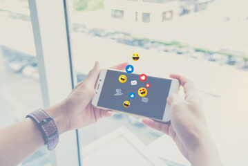 Hand using smart phone with living on vacation and playing social media. Concept social distancing 