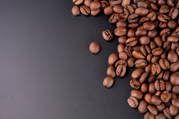 background of portion in organic coffee beans in the right corner with black background gradient to...