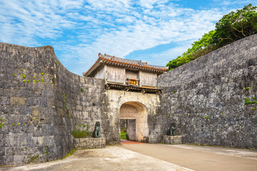 The first main gate of Shuri castle which the king and officers used. the words on it mean...
