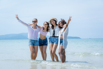 Group of friends having fun at the beach on holidays,Holiday in summer,Concept vacation.