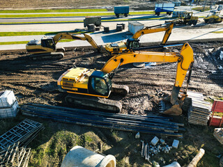 Several powerful excavators are working on the construction site. view from above. drone...