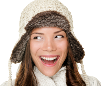 Winter woman looking sideways isolated cutout PNG on transparent background. Closeup portrait of beautiful winter girl wearing warm clothes looking to side. Chinese Asian / Caucasian female model.