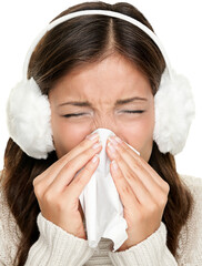 Flu or cold - sneezing woman sick blowing nose. Young woman being cold wearing earmuffs and...