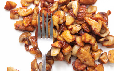 Fried mushrooms isolated on white background.