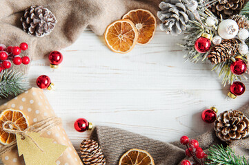 Christmas and winter cozy background with warm sweater and decorations.