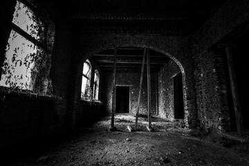 Fototapeta na wymiar black and white photo of an abandoned hall