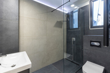 Bathroom interior with glass shower cabin