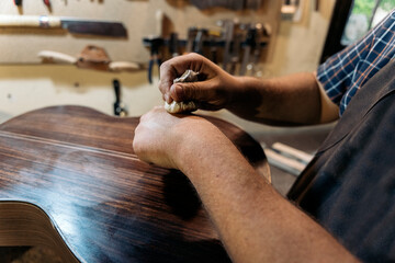 Craftsman Making Guitar