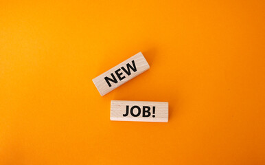 New job symbol. Wooden blocks with words New job. Beautiful orange background. Business and New job concept. Copy space.