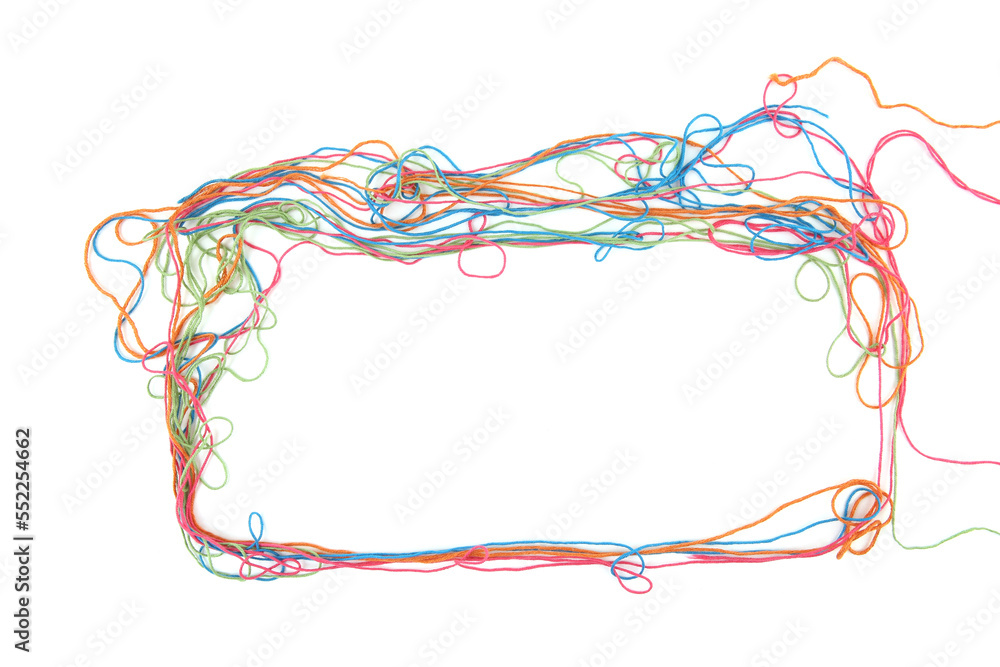 Wall mural frame of tangled colorful cotton threads isolated on white background. abstract thread lines chaos p