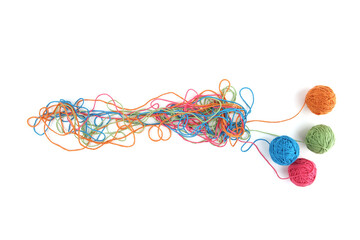 Tangled colorful cotton threads and balls isolated on white background. Abstract thread lines chaos...