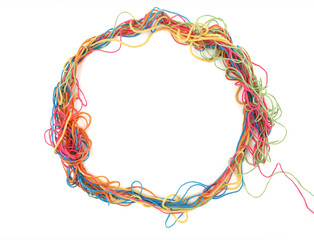 Circle of tangled colorful cotton threads isolated on white background. Abstract thread lines chaos...