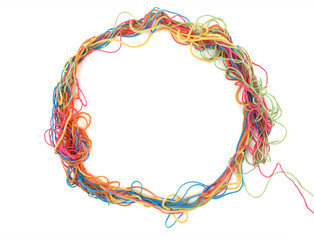 Circle of tangled colorful cotton threads isolated on white background. Abstract thread lines chaos pattern.