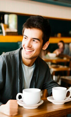 man drinking coffee in cafe steadicam shot