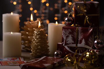 photo of lit candles and a mountain of presents