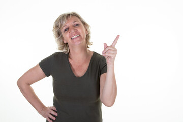 senior woman blonde middle aged pointing fingers aside copy space on white background