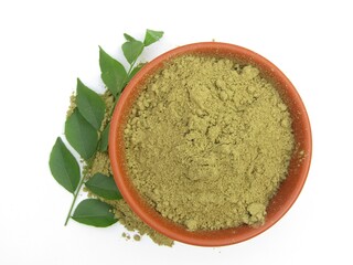 Curry leaves powder in a bowl on white background 