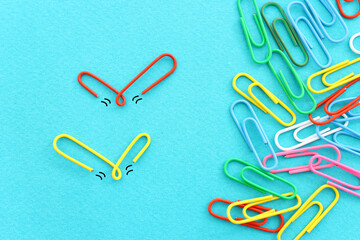 Concept image of unique thinking. Paper clips in the shape of birds. Idea of teamwork and leadership