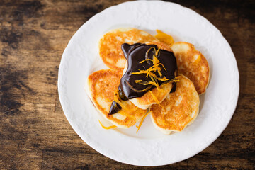 Small pancakes with chocolate glaze, top view