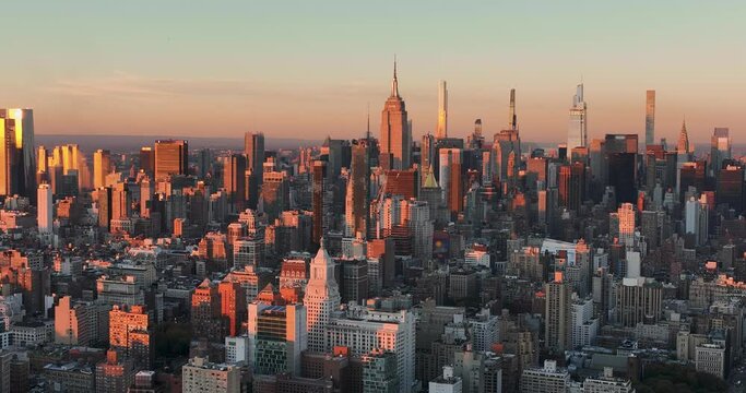 Aerial panorama of  Manhattan tall buildings, New York City at sunset. City skyline panorama