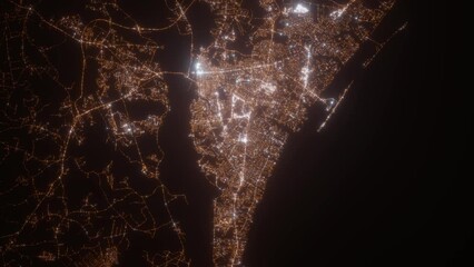 Wilmington (North Carolina, USA) aerial view at night. Top view on modern city with street lights. Camera is zooming out, rotating clockwise