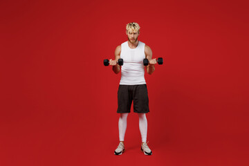 Full body young strong powerful sporty toned sportsman man wear white clothes spend time in home...