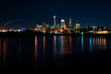 Fototapeta na wymiar Colorful city lights at night over Lake Erie.