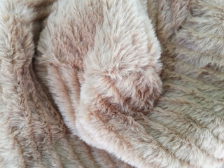 brown wool or micro fiber with fluffy texture. 