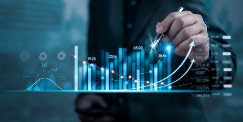 Businessman holding pen growth graph and progress of business and analyzing financial and investment data planning and strategy, Stock market, progress or success concept.