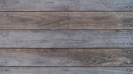 Wooden background made of old wooden planks and nails.
