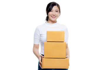 Happy Asian girl holding package parcel boxs isolated on transparent background, PNG file format. Delivery courier and shipping service concept.