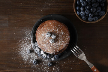 Concept of sweet food, chocolate pancakes, top view