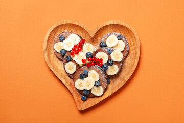 Concept of sweet food, chocolate pancakes, top view