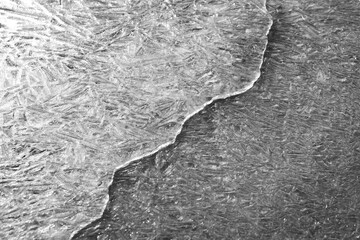 Crack on the ice surface of a frozen reservoir, river or lake,.