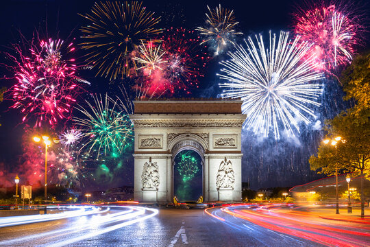 New Year fireworks display over the Arc de Triomphe in Paris. France - Powered by Adobe