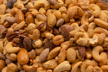 A group of almonds, pistachios, walnuts, macadamia, cashews.