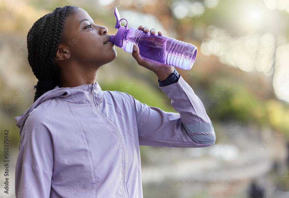 Poster Black woman runner, drinking water bottle or rest for hydration, wellness and health in summer training. Woman, running and drink water for exercise, workout or fitness at nature park in California