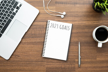 Notebook with 2023 goals text on it to apply new year resolutions and plan.