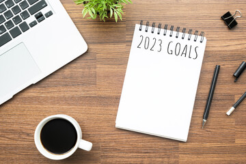 Notebook with 2023 goals text on it to apply new year resolutions and plan.