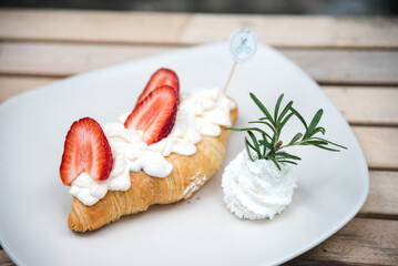 Fresh croissants with strawberries 
