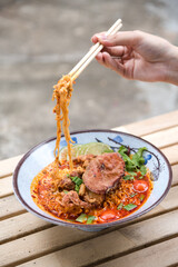 Spicy  ramen with red crab on top. It has abalone and mussels, so the soup is really good.