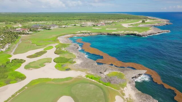 Aerial over stunning Corales Golf Course on scenic Caribbean coastline