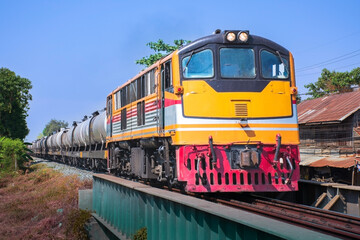 Fototapeta premium Tanker-freight train by diesel locomotive on the railway.