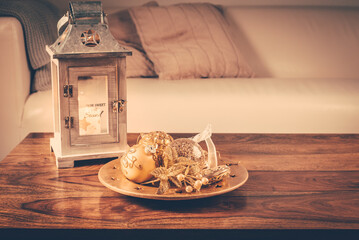 Christmas ornaments on wooden table in cosy home