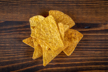 Corn chips nachos on wood texture background