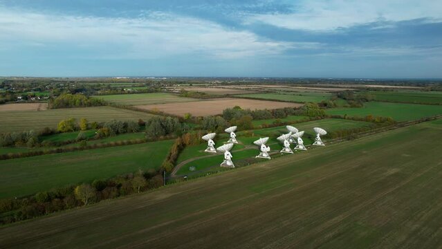 Aerial view towards Mullard MRAO radio telescope observatory array on Cambridge farming countryside