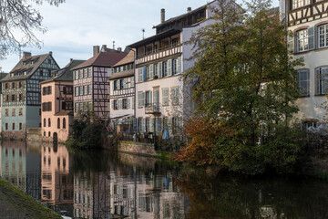 View over the river Ill to an old row of half-timbered houses in Petit France in winter in Strasbourg, France