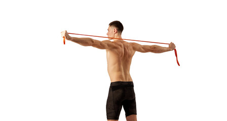 Back view of muscular young man doing excersice with expander rope isolated over white background....