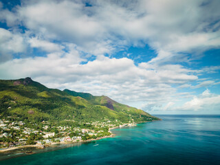 Aerial landscape overlooking the coastline of Mae Island in the Seychelles. Turquoise water of the Indian Ocean, tropical trees and beaches