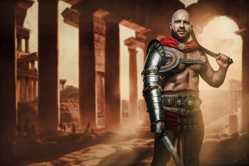 Fototapeta na wymiar Portrait of ancient gladiator with bare torso posing with dual swords on ancient ruins.